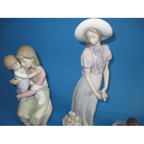 86 - A collection of Lladro figures, the 2383 girl has a damaged petal to her hair flower and the owl has... 