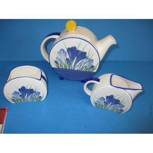 87 - A Wedgwood Clarice Cliff Bonjour 3 piece teaset in the Blue Crocus design, the sugar bowl has been r... 