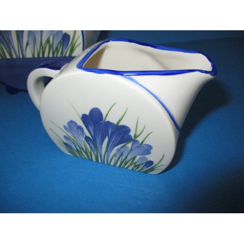 87 - A Wedgwood Clarice Cliff Bonjour 3 piece teaset in the Blue Crocus design, the sugar bowl has been r... 