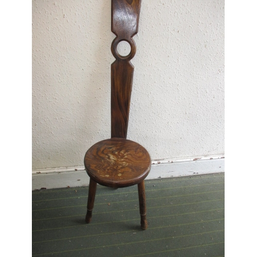 93 - A hard wood hall chair, having slender back splat, having use-related marks