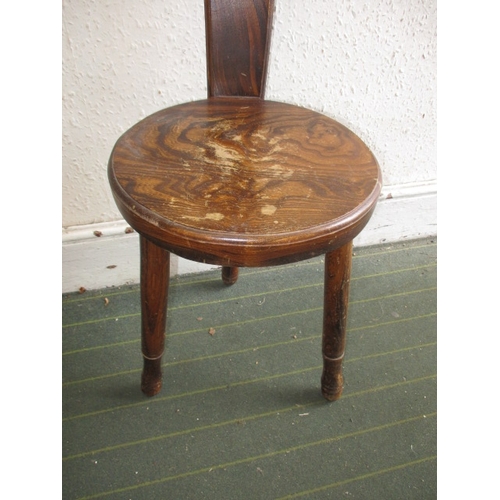 93 - A hard wood hall chair, having slender back splat, having use-related marks