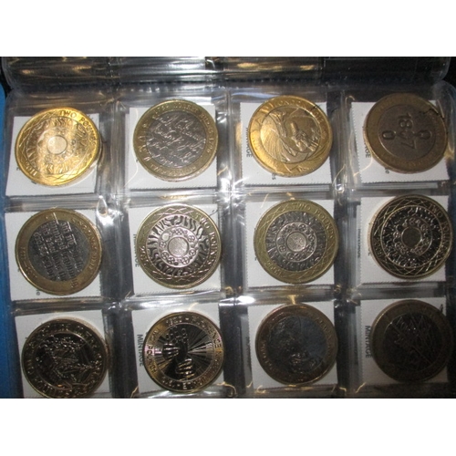 99 - A large quantity of collectable £2 coins, some in uncirculated condition in packaging, over 75 in to... 