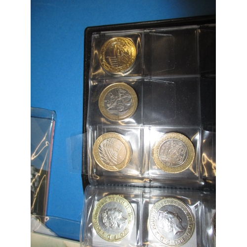 99 - A large quantity of collectable £2 coins, some in uncirculated condition in packaging, over 75 in to... 