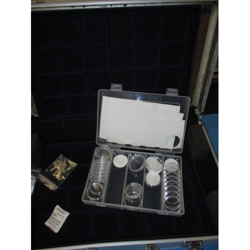 101 - A parcel of coin collectors accessories, to include cases and a cabinet, numerous display trays with... 