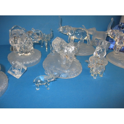 103 - A parcel of glass elephant sculptures, various sizes, one with a tiny chip to tail tip all others  w... 