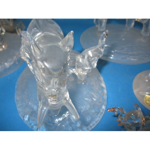 103 - A parcel of glass elephant sculptures, various sizes, one with a tiny chip to tail tip all others  w... 