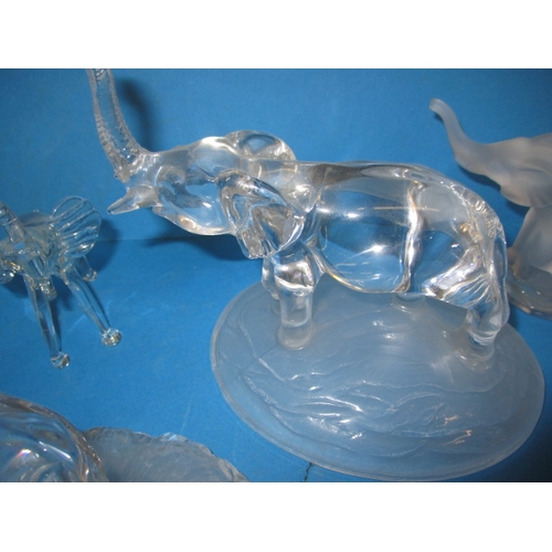 103 - A parcel of glass elephant sculptures, various sizes, one with a tiny chip to tail tip all others  w... 