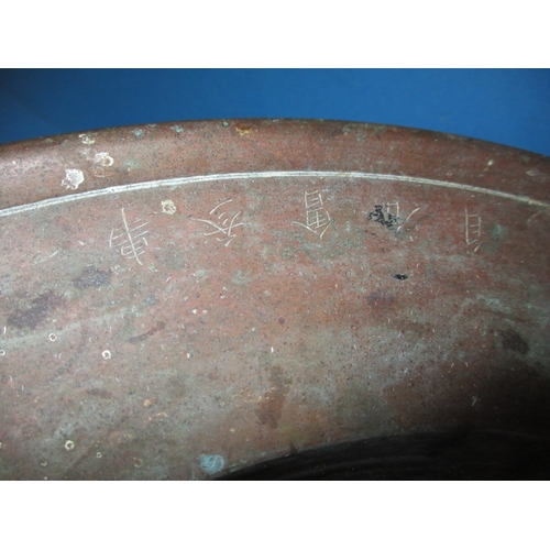 165 - A vintage oriental bronze footed bowl with signature to rim, having tarnish and age-related marks, a... 