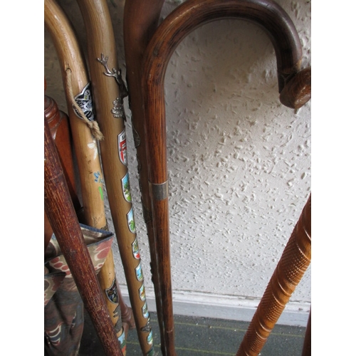 171 - A vintage hall stick stand, with numerous walking sticks and umbrellas, various sizes and ages, all ... 