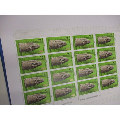 179 - A very large quantity of mainly Guernsey stamps, to include mint examples, part sheets, quads and va... 