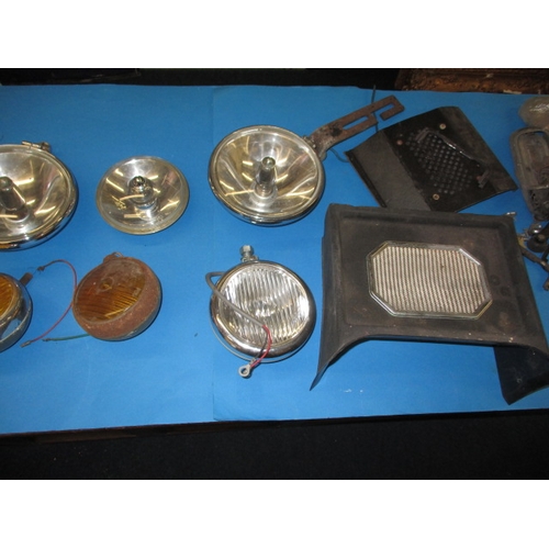 188 - A parcel of vintage automotive spot and fog lamps, and other car spares to include an MG speaker con... 