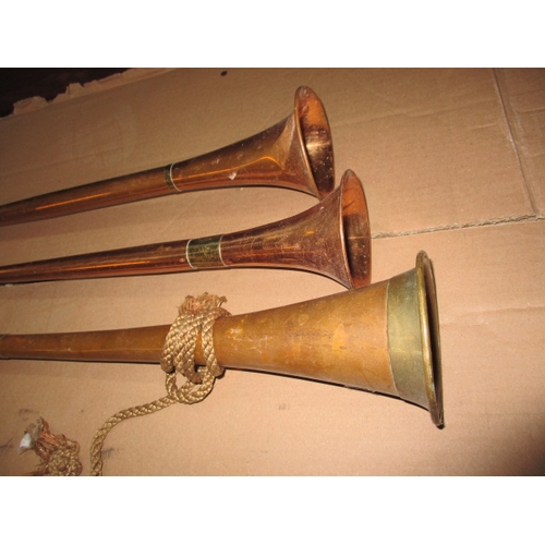 191 - Three copper post horns, some denting and general age-related marks, approx. length of longest 108cm