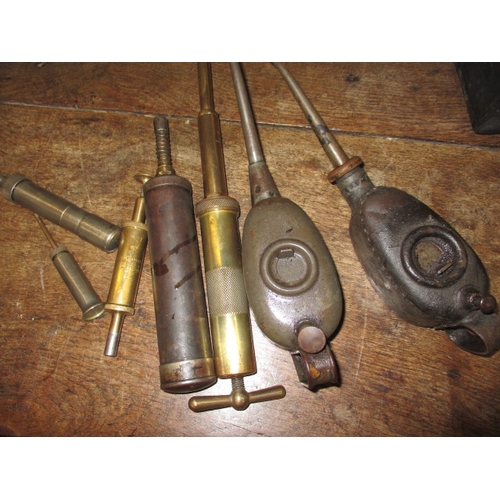 197 - A collection of vintage oil cans and grease guns, all in used condition