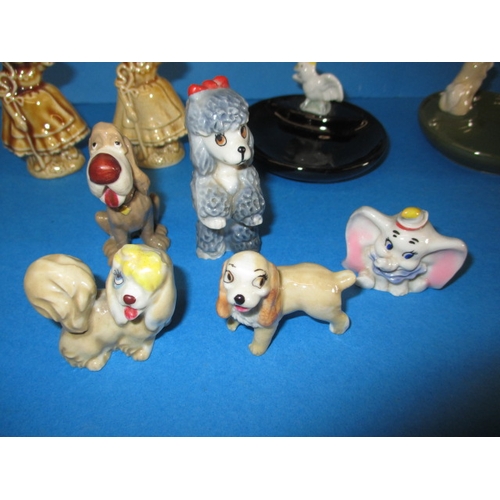 199 - A large collection of Wade ceramic whimseys, to include some Disney characters, very few have minor ... 