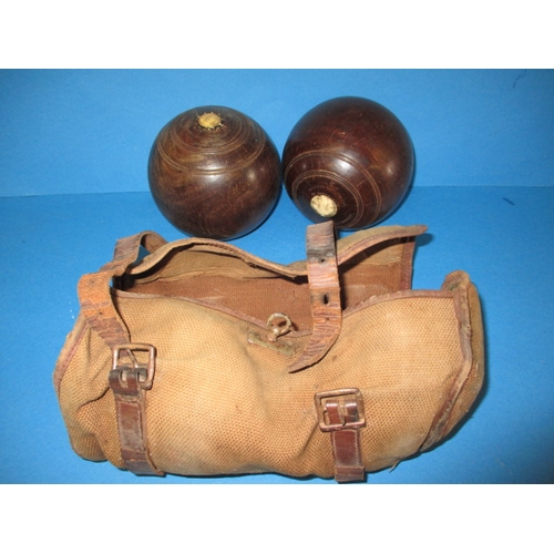 209 - Two lignum vitae wood bowls, in original carry bag, having use related marks