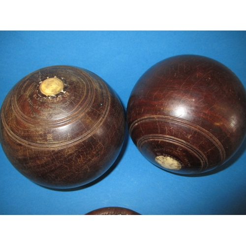 209 - Two lignum vitae wood bowls, in original carry bag, having use related marks