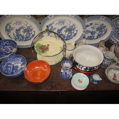 215 - A very large quantity of vintage ceramics, to include cake stands, platters, various makers, all in ... 