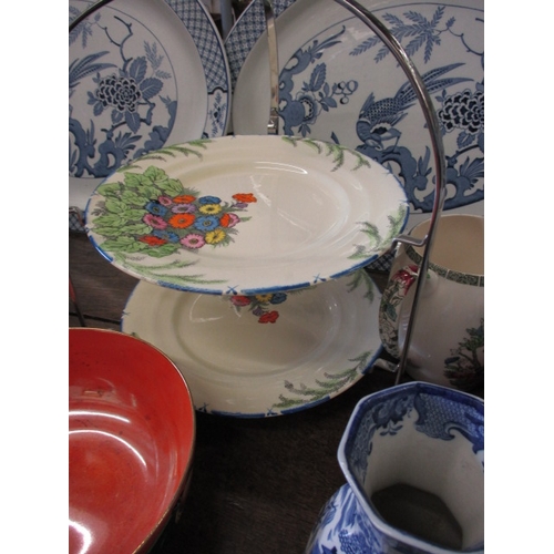 215 - A very large quantity of vintage ceramics, to include cake stands, platters, various makers, all in ... 