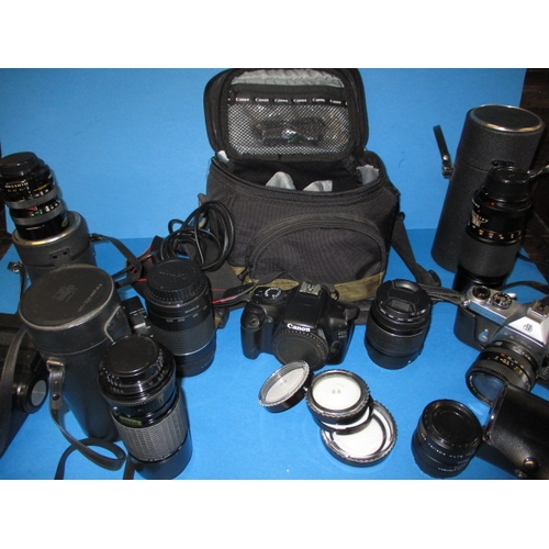 219 - A parcel of cameras and lenses, all in used condition and none tested as to function