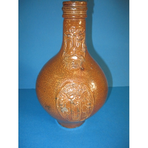 200 - An antique Bellarmine salt glazed stoneware jug, approx. height 23.5cm, in good condition with age-r... 