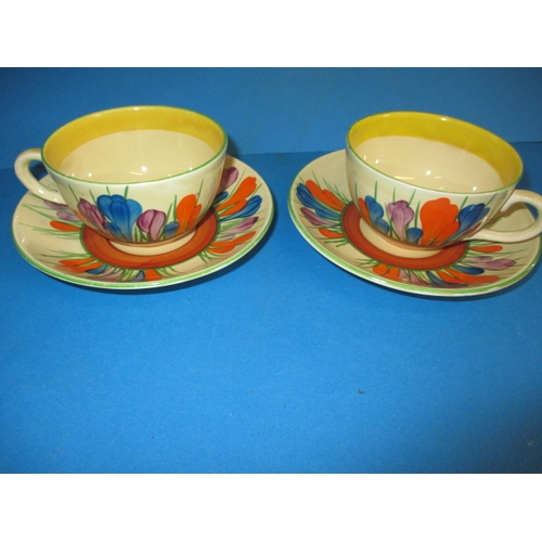 201 - Two original Clarice Cliff autumn crocus design cups and saucers, having hand written green crocus w... 