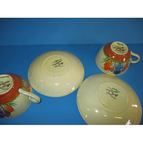 201 - Two original Clarice Cliff autumn crocus design cups and saucers, having hand written green crocus w... 