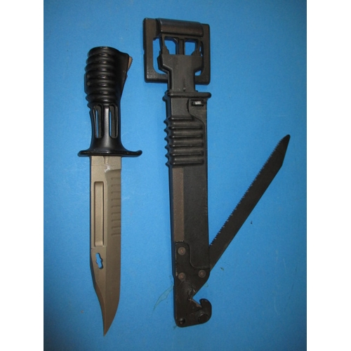 221 - An unused SA80 Bayonet and sheath, having wire cutter, saw blade and sharpening stone, in good pre-o... 