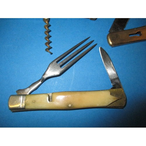 197 - A vintage pocket knife with numerous utensils, separates on slides to make 3 pieces, some damage to ... 