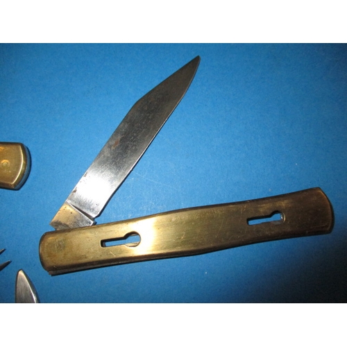 197 - A vintage pocket knife with numerous utensils, separates on slides to make 3 pieces, some damage to ... 