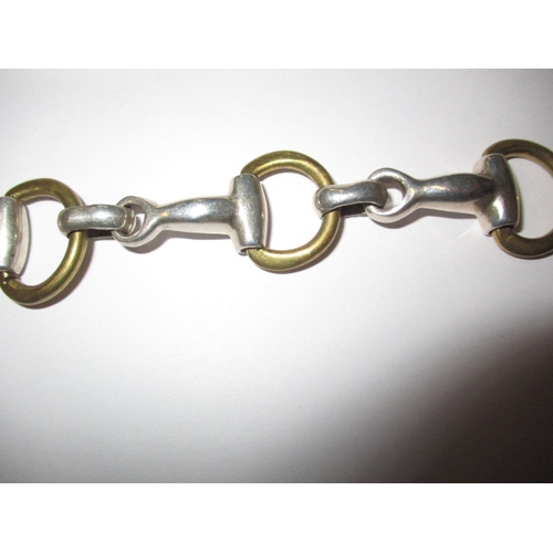 172 - A sterling silver necklace, approx. linear length 56cm and a silver and yellow metal bracelet, appro... 