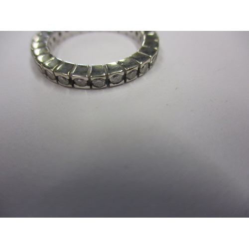 24 - A vintage eternity ring, marked 750, approx. ring size ‘G+’, approx. weight 3g, in used condition