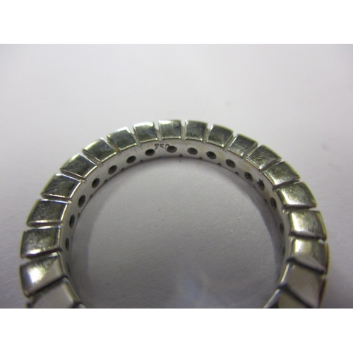 24 - A vintage eternity ring, marked 750, approx. ring size ‘G+’, approx. weight 3g, in used condition