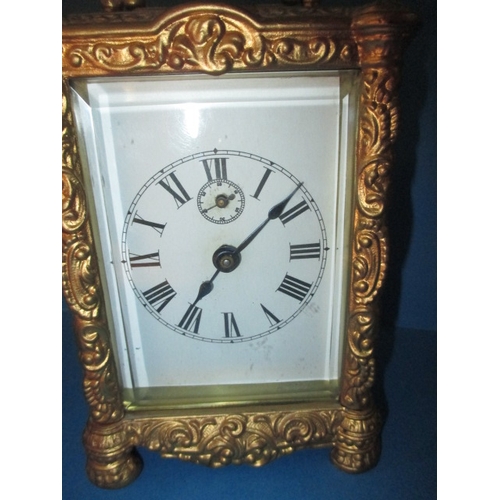 232 - A vintage gilt metal carriage clock, striking on a bell, age-related marks and no key so not tested ... 