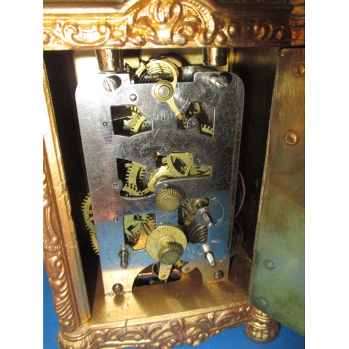 232 - A vintage gilt metal carriage clock, striking on a bell, age-related marks and no key so not tested ... 