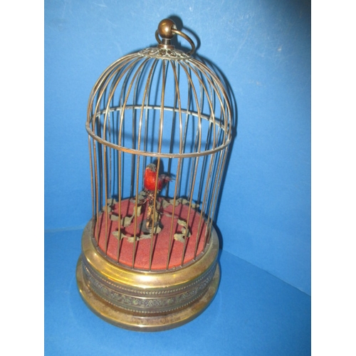 211 - A vintage caged singing bird automaton, in working order with general age-related marks, approx. hei... 