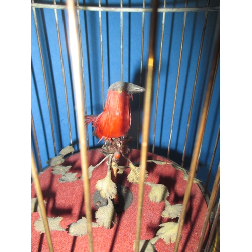 211 - A vintage caged singing bird automaton, in working order with general age-related marks, approx. hei... 