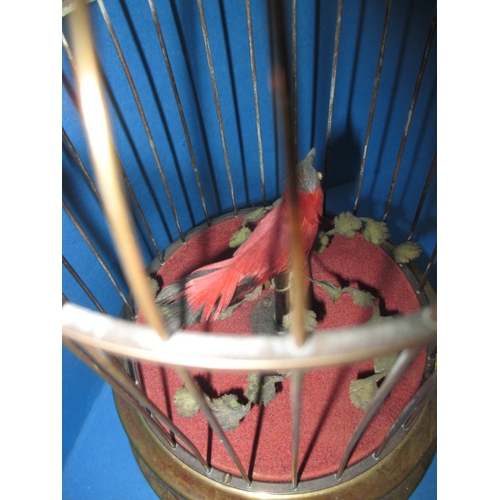 211 - A vintage caged singing bird automaton, in working order with general age-related marks, approx. hei... 