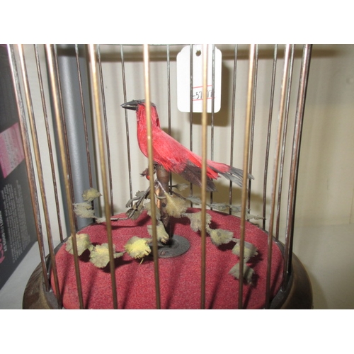 211 - A vintage caged singing bird automaton, in working order with general age-related marks, approx. hei... 