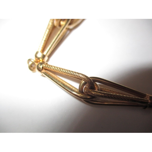 64 - A 750 yellow gold bracelet, in pre-owned condition with working clasp, approx. weight 10g