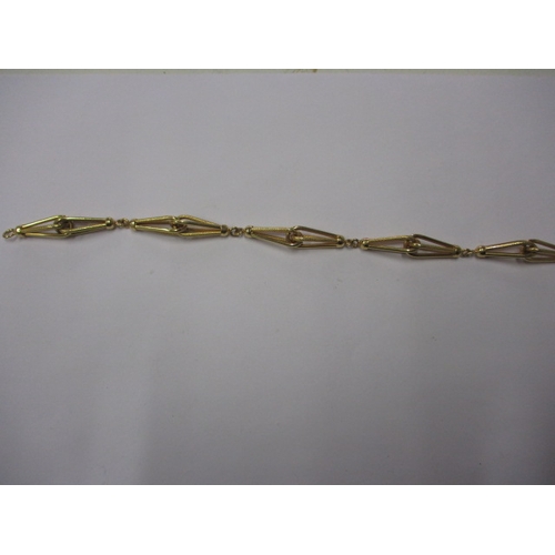 64 - A 750 yellow gold bracelet, in pre-owned condition with working clasp, approx. weight 10g