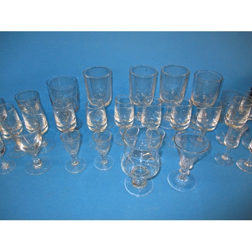 289 - A large quantity of antique and later drinking glasses, various dates and styles, all in used condit... 