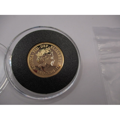 An Elizabeth II full gold sovereign dated 2019, in uncirculated condition, in encapsulated plastic coin holder
