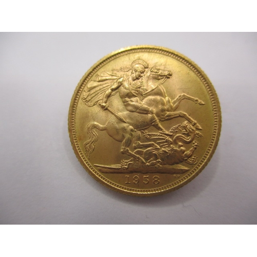 126 - An Elizabeth II full gold sovereign dated 1958, in near uncirculated condition with very good defini... 