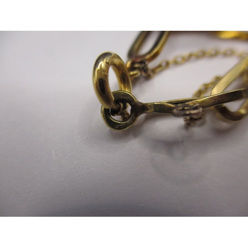 65 - An  18ct yellow gold charm bracelet, with 18ct charms, approx. gross weight 11.5g, in used condition... 