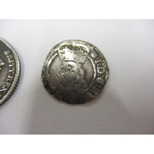 140 - A James I silver half groat, a George III silver 1816 sixpence and two other coins, all in circulate... 