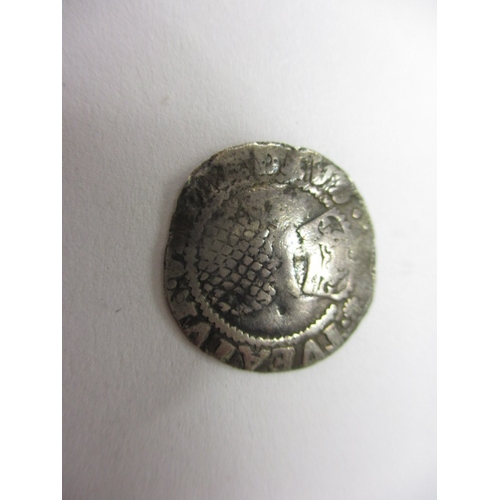 140 - A James I silver half groat, a George III silver 1816 sixpence and two other coins, all in circulate... 