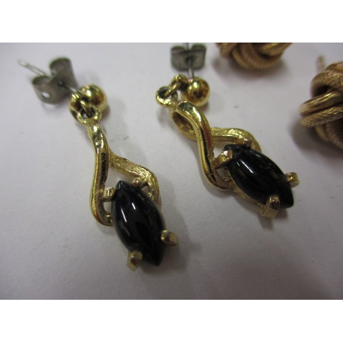 67 - Three pairs of gold and yellow metal earrings, approx. parcel weight 6.5g, all in used condition