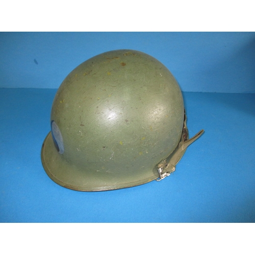 217 - A WWII Dutch? Army helmet, in well used condition