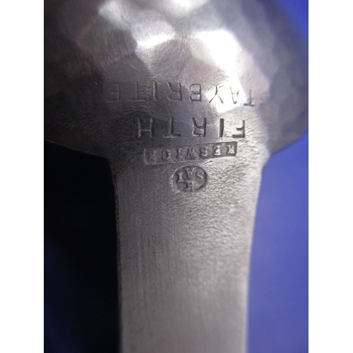 187 - An Arts & Craft hand beaten stainless steel caddy spoon with K.S.I.A mark for Keswick to back, in go... 