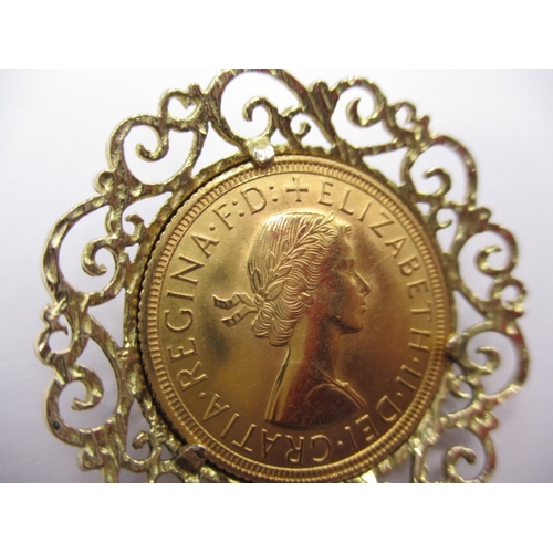 127 - A Queen Elizabeth II gold sovereign, dated 1958 in yellow metal mount, approx. gross parcel weight 1... 